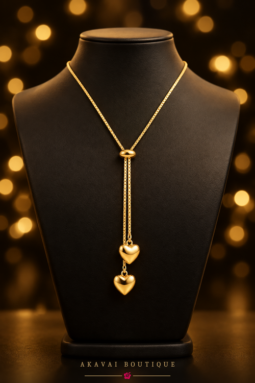 Collier Ardeur, deux cœurs dorés en acier inoxydable, sur buste noir